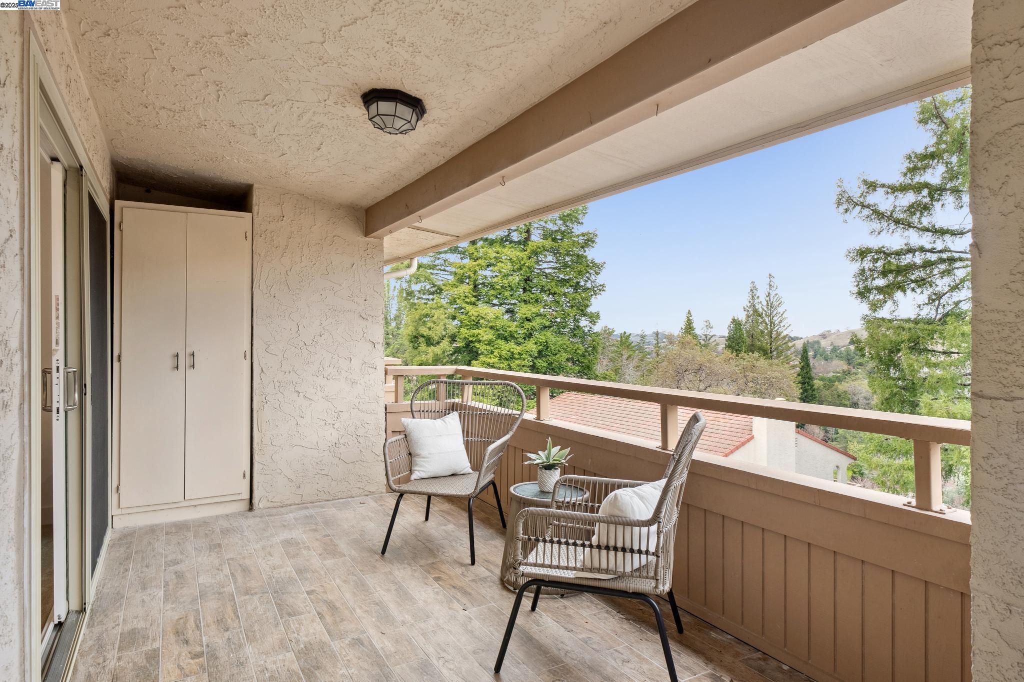4033 Terra Granada Drive, Unit 5C Walnut Creek, CA 94595 - Photo 33 of 44 a view of chair and table in the balcony