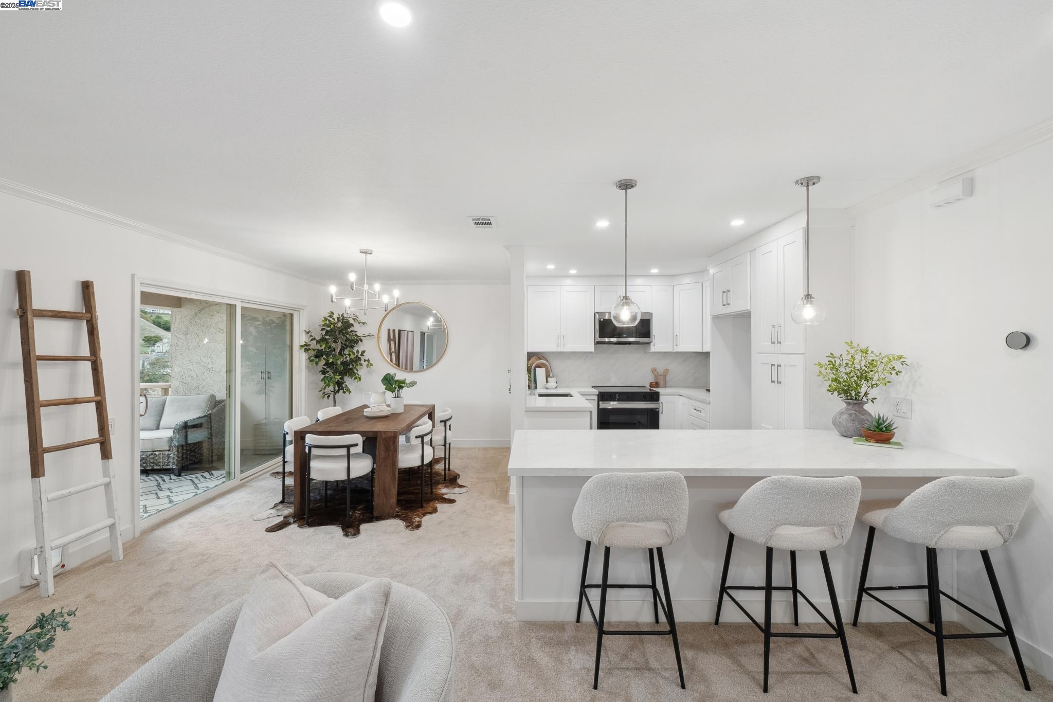 4033 Terra Granada Drive, Unit 5C Walnut Creek, CA 94595 - Photo 7 of 44 a living room with furniture and a dining table with kitchen view
