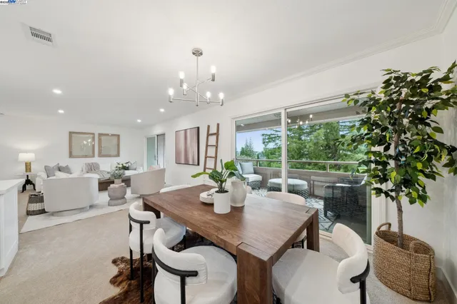 a view of a dining room with furniture window and outside view