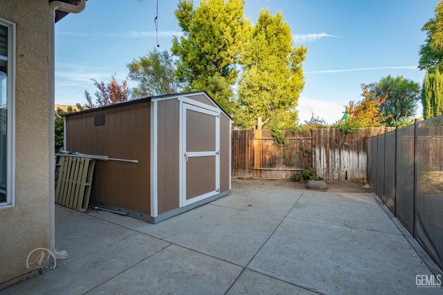 Undisclosed Address Bakersfield, CA 93312 - Photo 18 of 20 a backyard of a house with a tree and fence