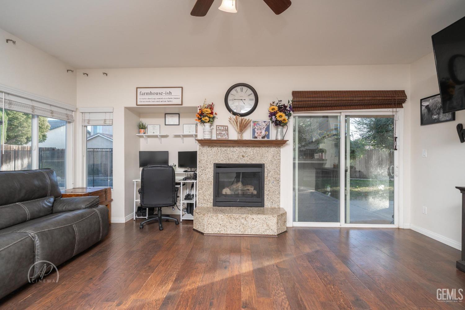 Undisclosed Address Bakersfield, CA 93312 - Photo 7 of 20 a living room with furniture and a fireplace