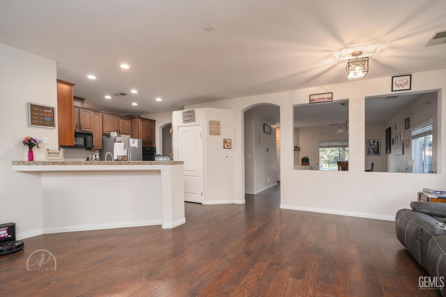Undisclosed Address Bakersfield, CA 93312 - Photo 8 of 20 a view of kitchen with stainless steel appliances refrigerator stove microwave and cabinets