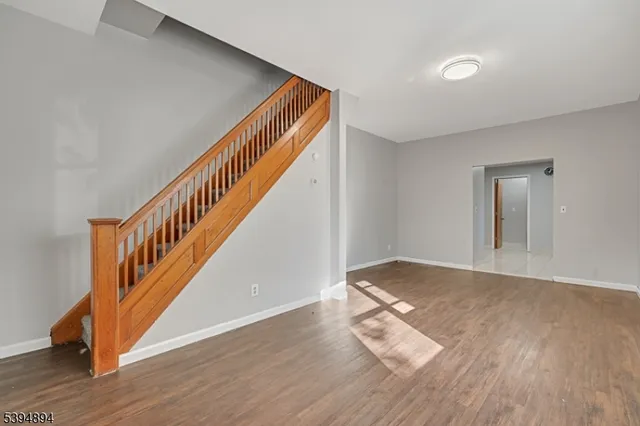 a view of entryway with wooden floor
