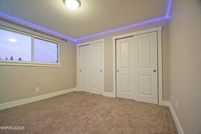 a bathroom with a sink a toilet and vanity