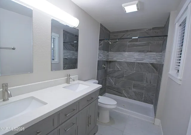 a bathroom with a shower and a bath tub