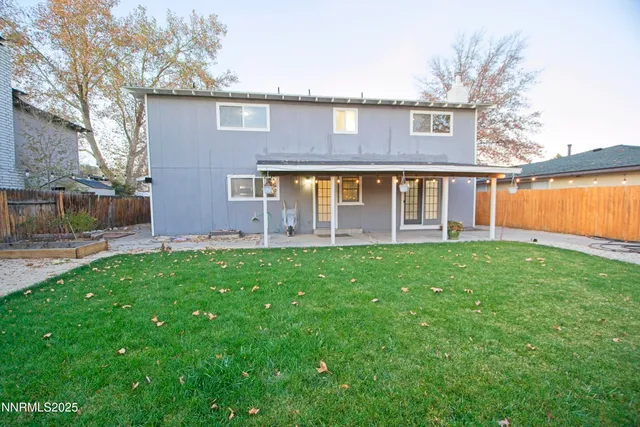 a front view of a house with trees