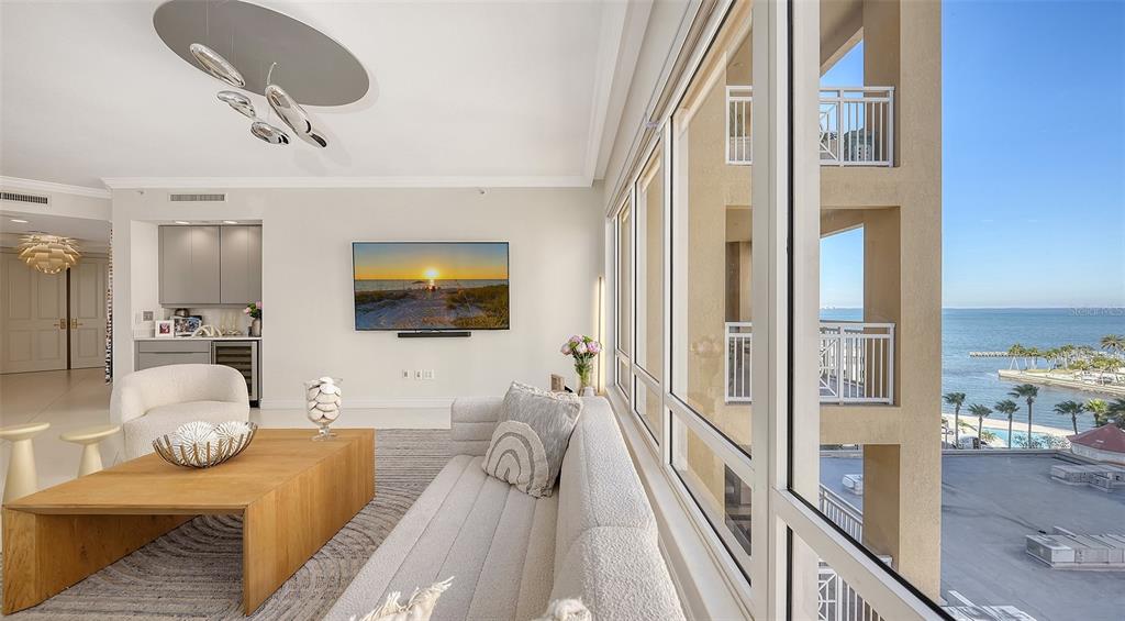 35 Watergate Drive, Unit 806 Sarasota, FL 34236 - Photo 13 of 67 a living room with furniture and a flat screen tv