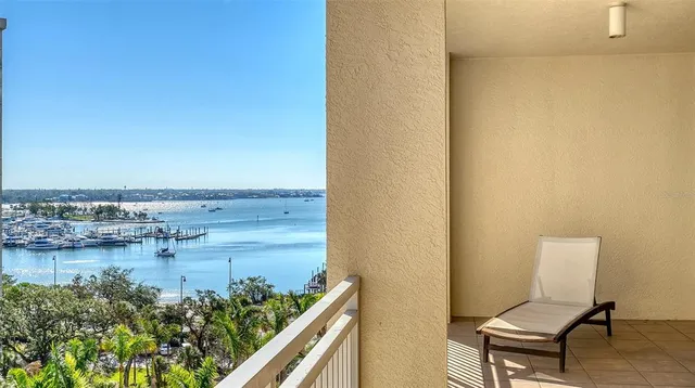 a view of swimming pool with outdoor seating and city view