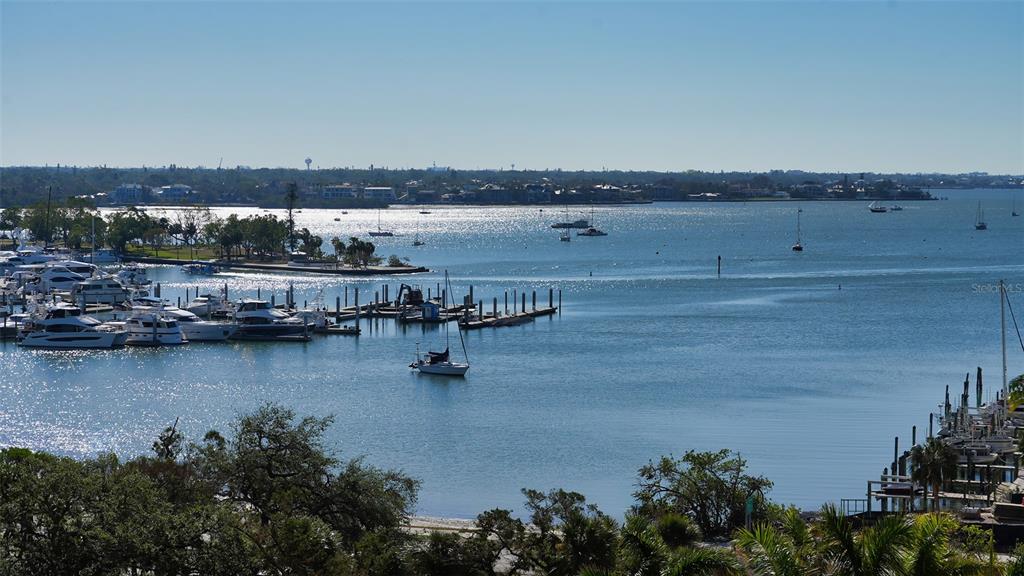 35 Watergate Drive, Unit 806 Sarasota, FL 34236 - Photo 23 of 67 a view of ocean with boats and trees in the background