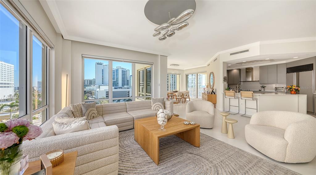 35 Watergate Drive, Unit 806 Sarasota, FL 34236 - Photo 26 of 67 a living room with furniture and a large window