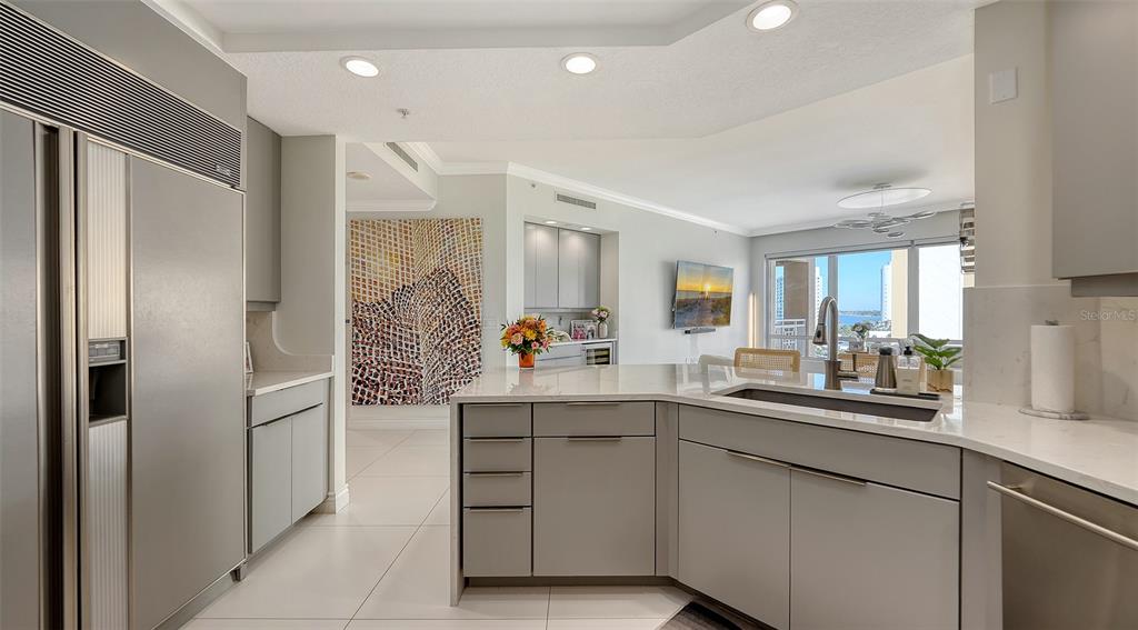 35 Watergate Drive, Unit 806 Sarasota, FL 34236 - Photo 31 of 67 a kitchen with a sink and refrigerator
