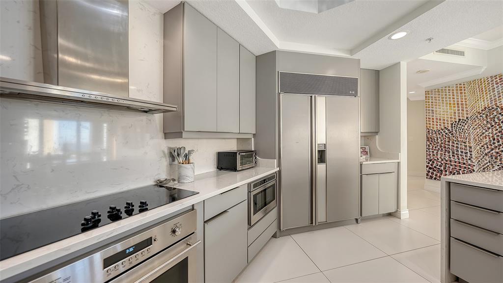 35 Watergate Drive, Unit 806 Sarasota, FL 34236 - Photo 32 of 67 a kitchen with stainless steel appliances a refrigerator sink and cabinets
