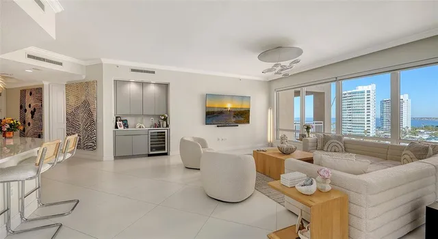 a bedroom with a large bed and a balcony