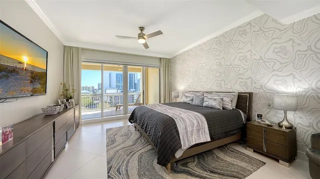 a bedroom with furniture and a flat screen tv