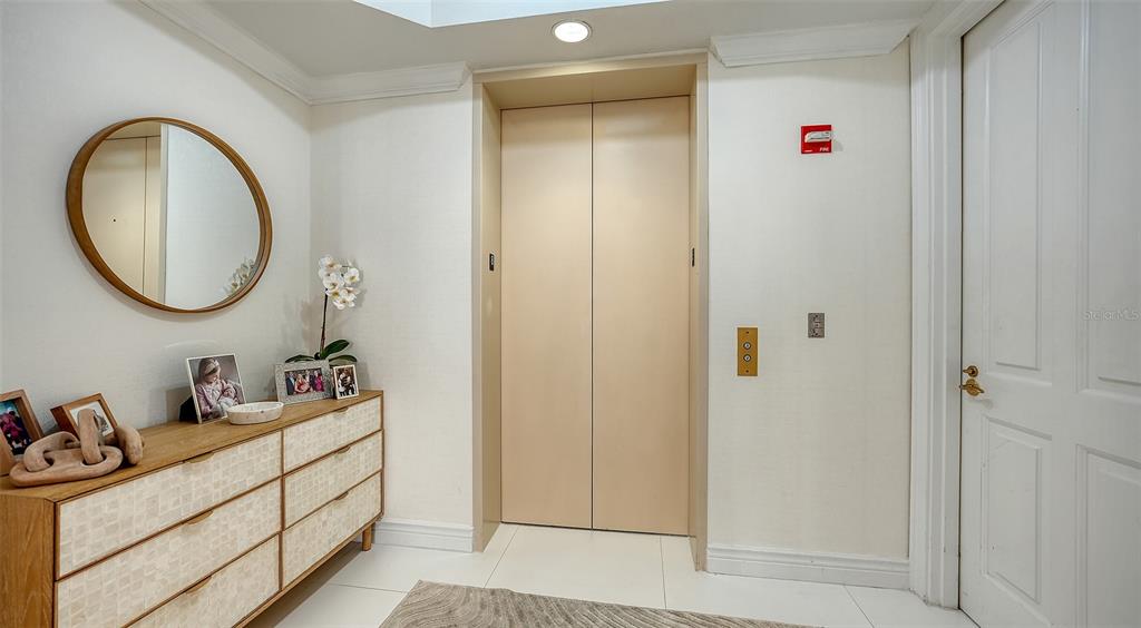 35 Watergate Drive, Unit 806 Sarasota, FL 34236 - Photo 4 of 67 a bathroom with a sink and a mirror