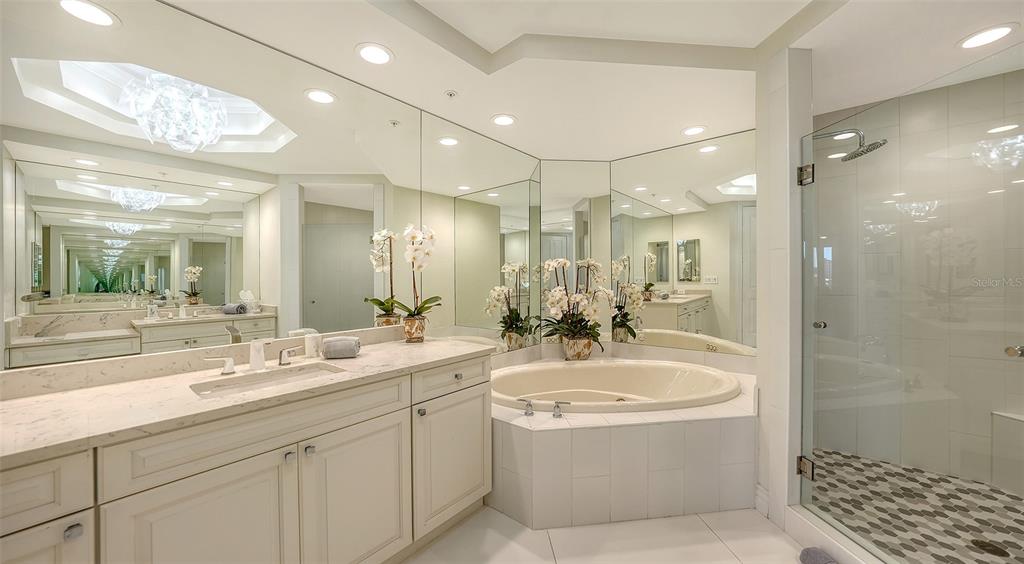 35 Watergate Drive, Unit 806 Sarasota, FL 34236 - Photo 45 of 67 a bathroom with a sink double vanity shower and a mirror