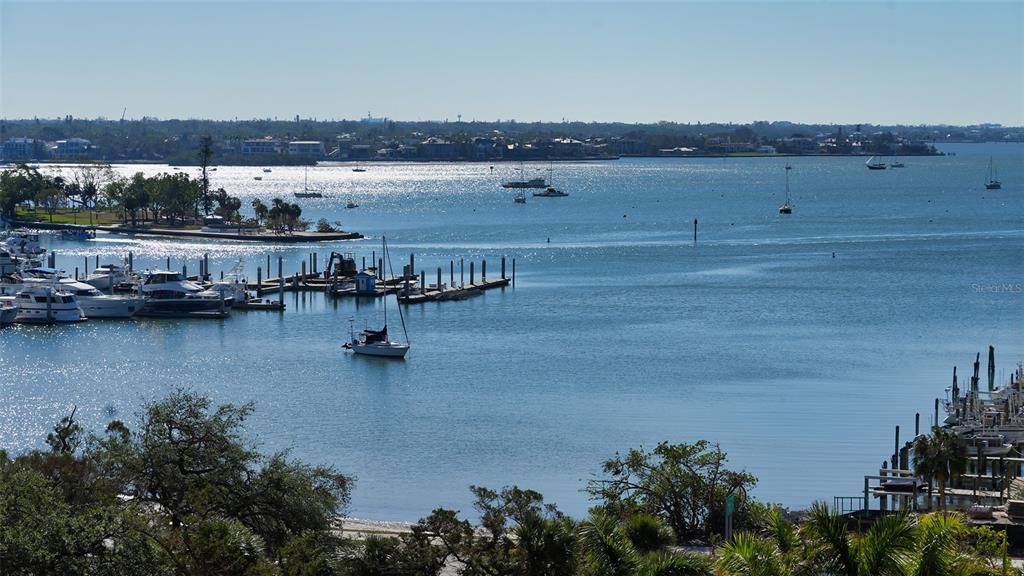 35 Watergate Drive, Unit 806 Sarasota, FL 34236 - Photo 57 of 67 a view of ocean with boats and trees in the background