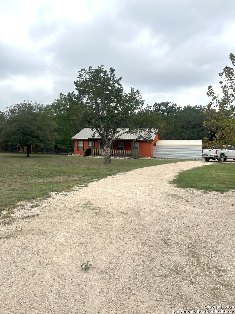a view of a lake with houses in the back