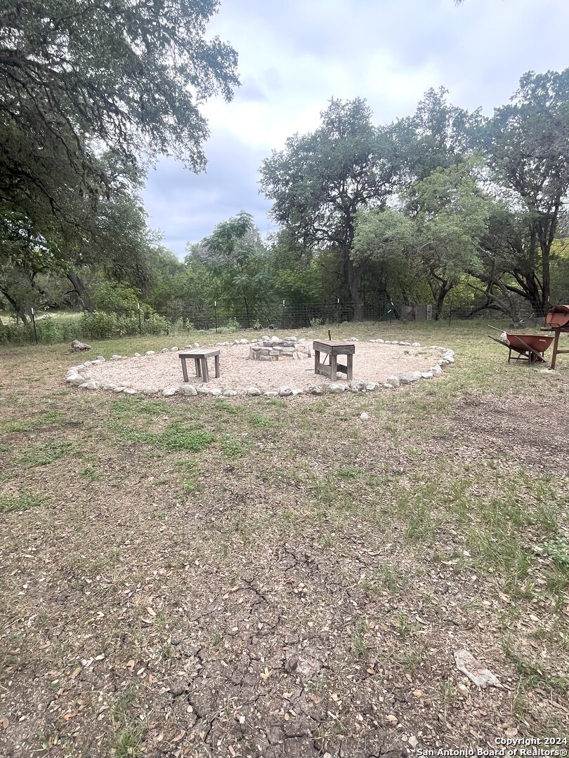143 Taff Leakey, TX 78873 - Photo 13 of 29 a view of a yard with a tree