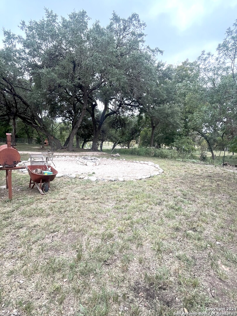 143 Taff Leakey, TX 78873 - Photo 16 of 29 a view of dirt yard with a large tree