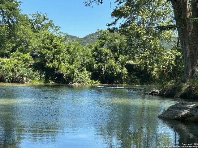 a view of lake with green space