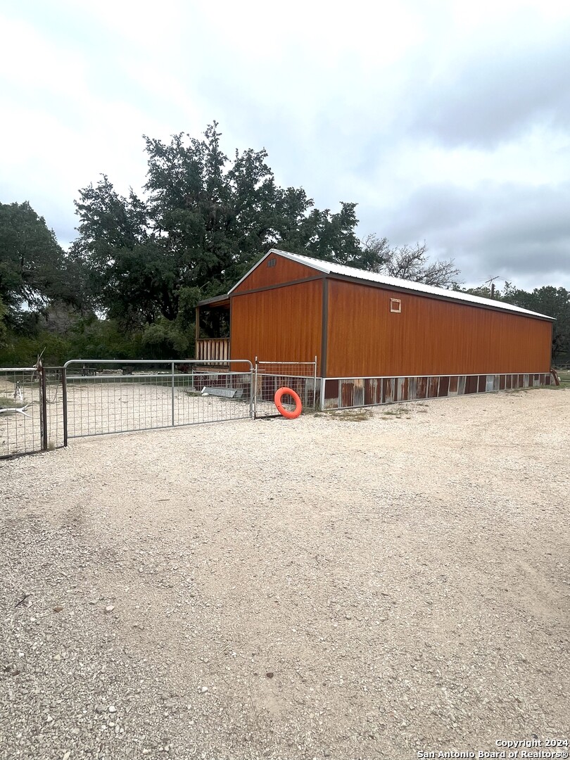 143 Taff Leakey, TX 78873 - Photo 8 of 29 a view of swimming pool with large trees