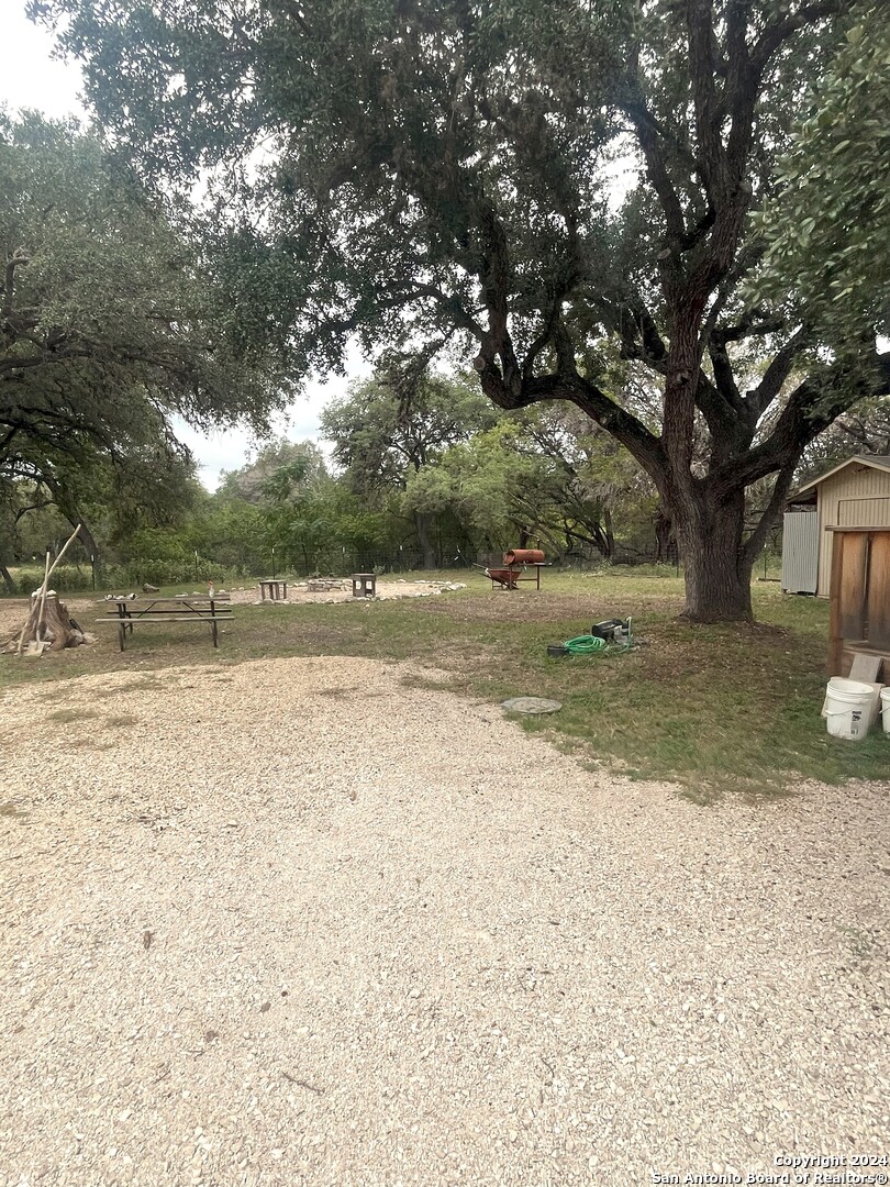 143 Taff Leakey, TX 78873 - Photo 10 of 29 a view of a yard with a tree