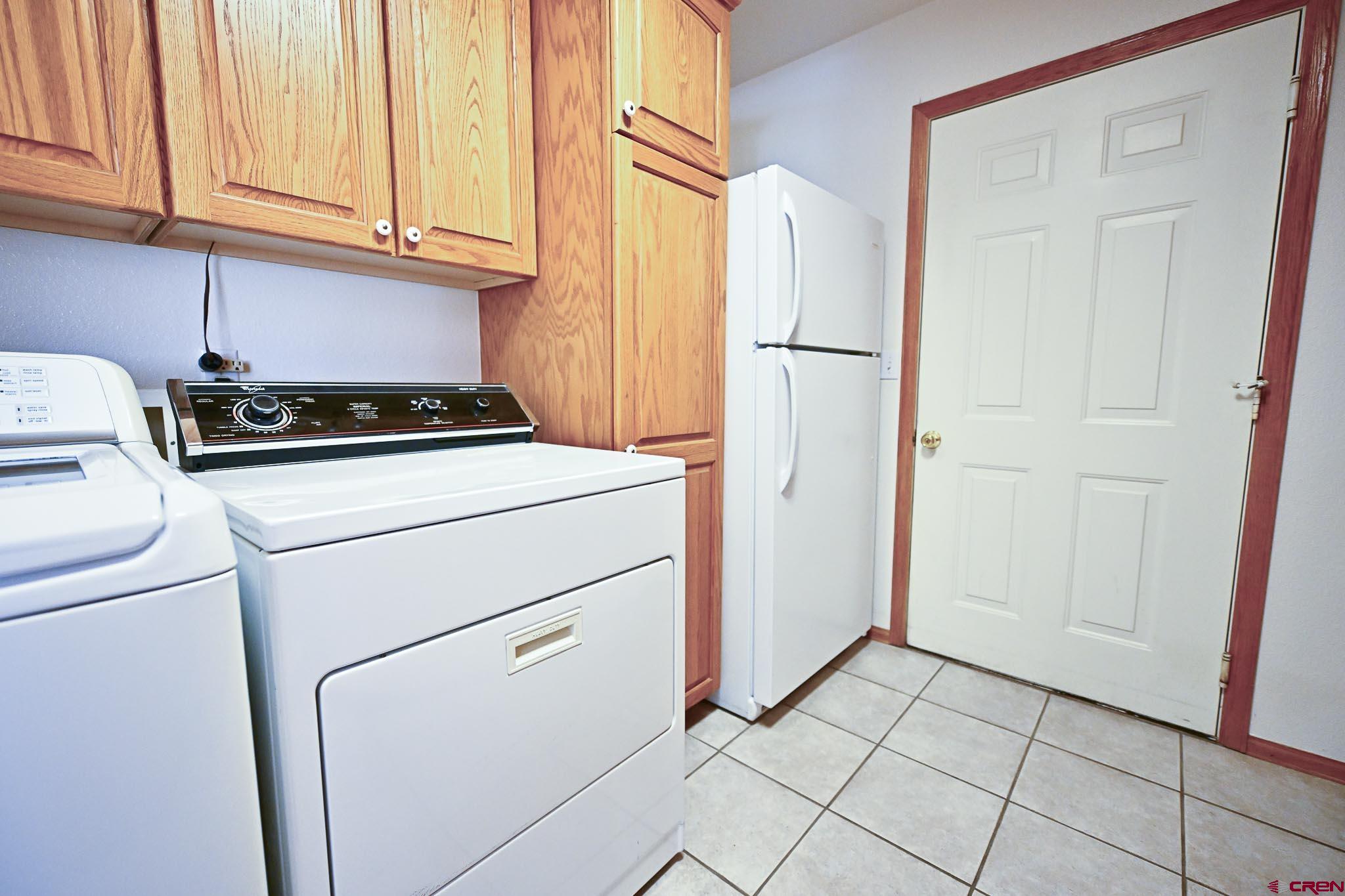 66750 Solar Road Montrose, CO 81403 - Photo 37 of 45 a view of a storage and utility room with washer and dryer