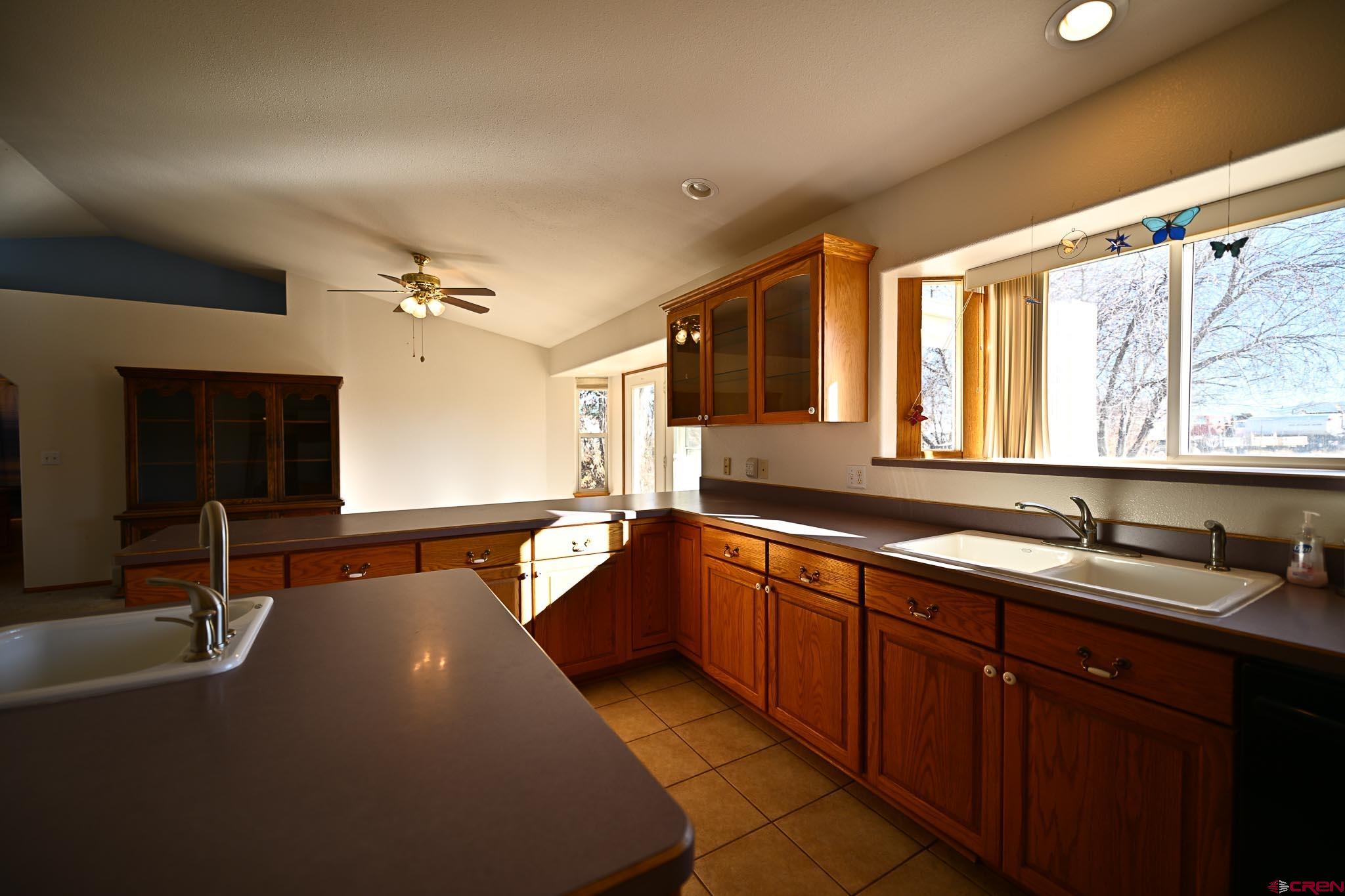 66750 Solar Road Montrose, CO 81403 - Photo 41 of 45 a spacious bathroom with a double vanity sink and a large mirror