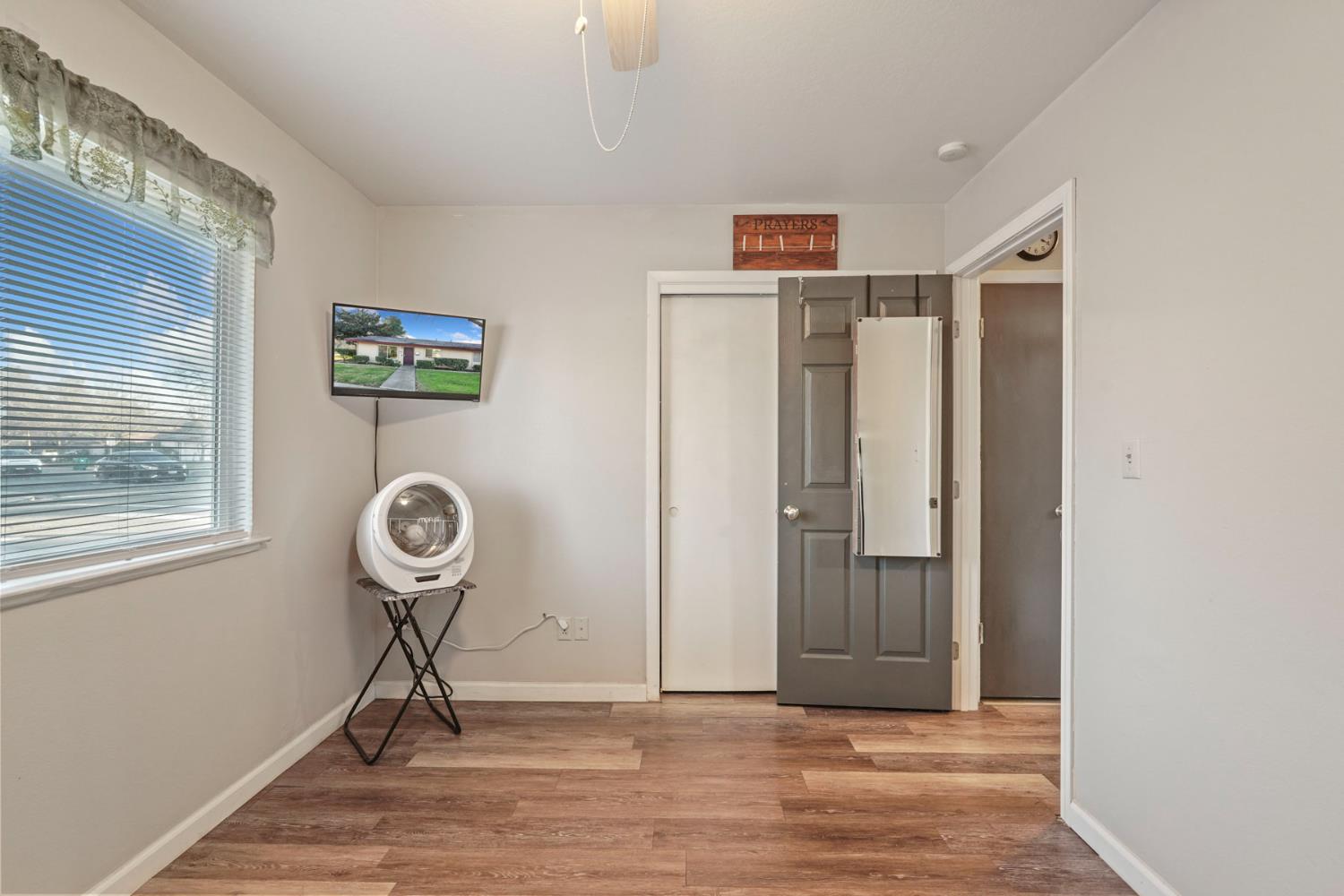 6103 Plymouth Road, Unit 1974 Stockton, CA 95207 - Photo 11 of 13 a view of empty room with window and fan