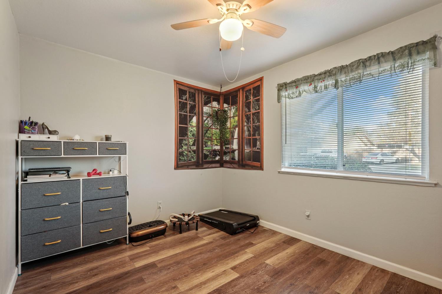 6103 Plymouth Road, Unit 1974 Stockton, CA 95207 - Photo 12 of 13 a view of a workspace with furniture and a window
