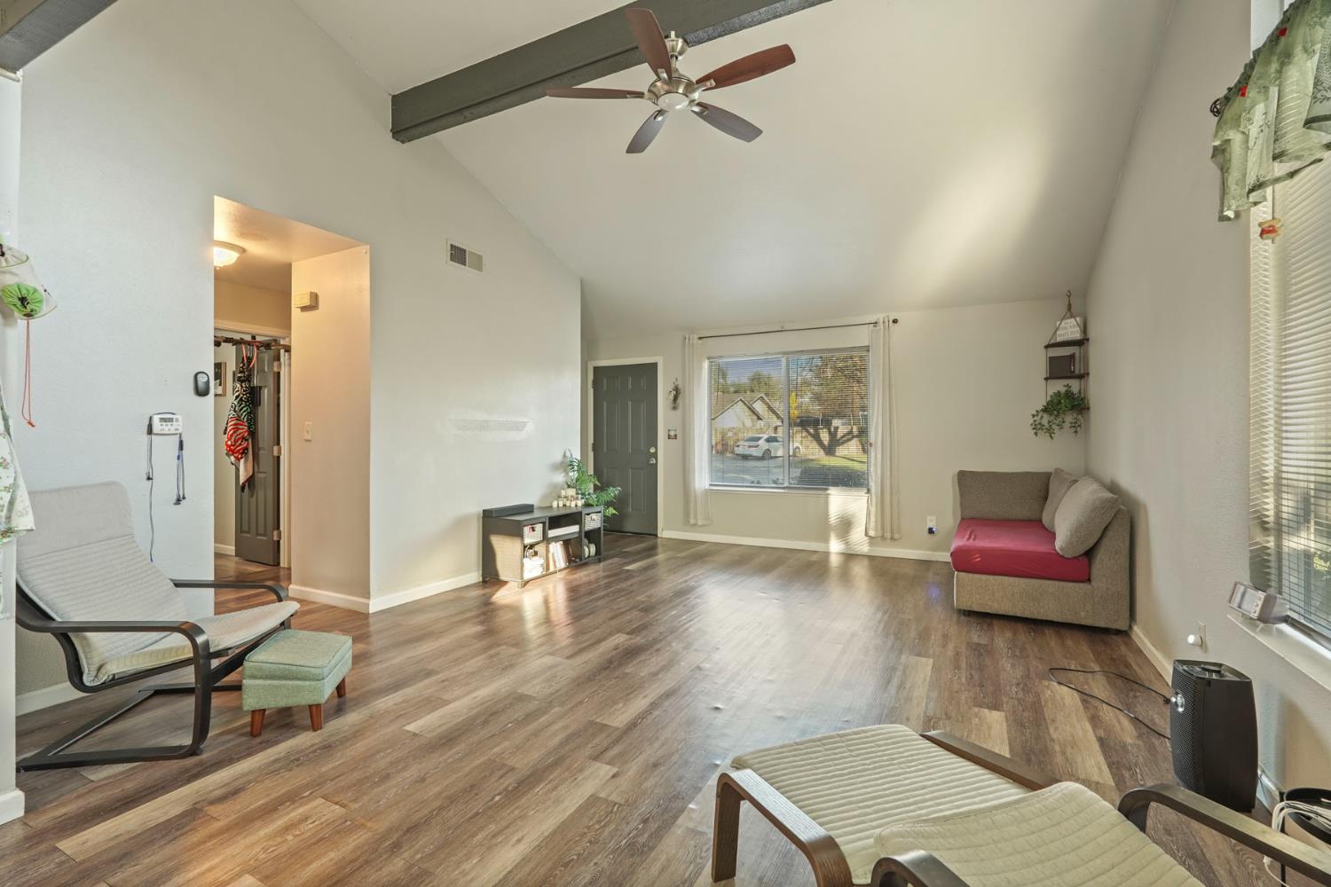 6103 Plymouth Road, Unit 1974 Stockton, CA 95207 - Photo 6 of 13 a living room with furniture and wooden floor