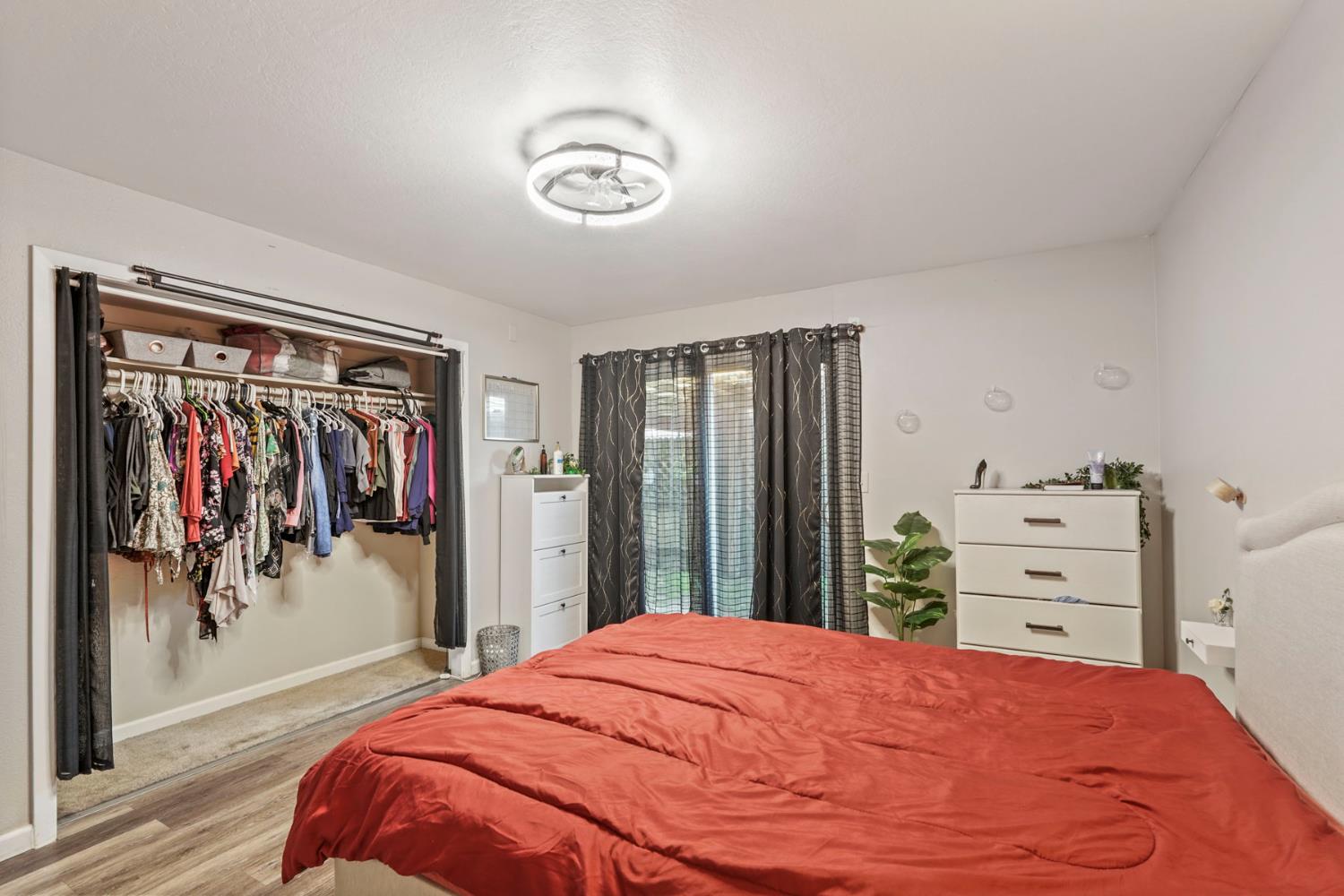6103 Plymouth Road, Unit 1974 Stockton, CA 95207 - Photo 8 of 13 a bedroom with a bed and a closet