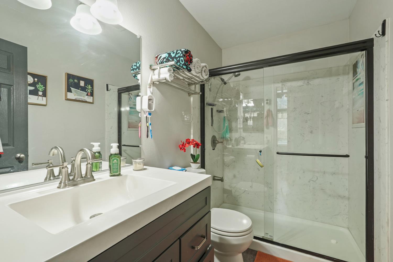 6103 Plymouth Road, Unit 1974 Stockton, CA 95207 - Photo 10 of 13 a bathroom with a sink toilet and shower