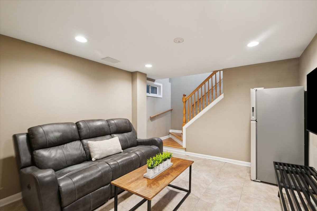 689 East Illinois Road Lake Forest, IL 60045 - Photo 16 of 18 a living room with furniture and stairs