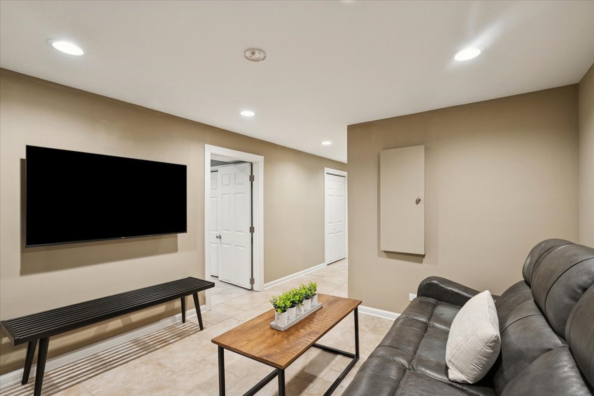 689 East Illinois Road Lake Forest, IL 60045 - Photo 17 of 18 a living room with furniture and a flat screen tv