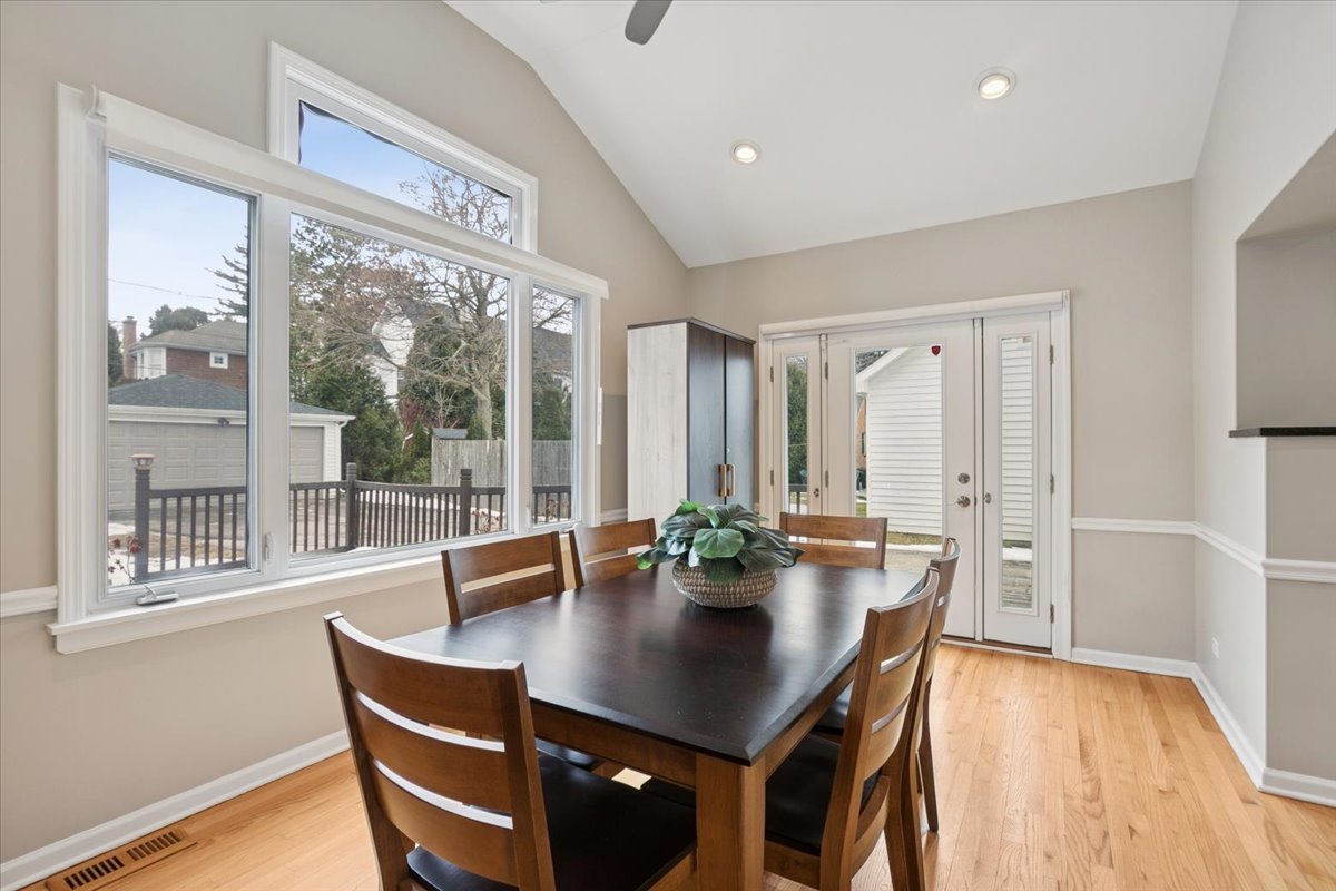689 East Illinois Road Lake Forest, IL 60045 - Photo 8 of 18 a view of a dining room with furniture and wooden floor