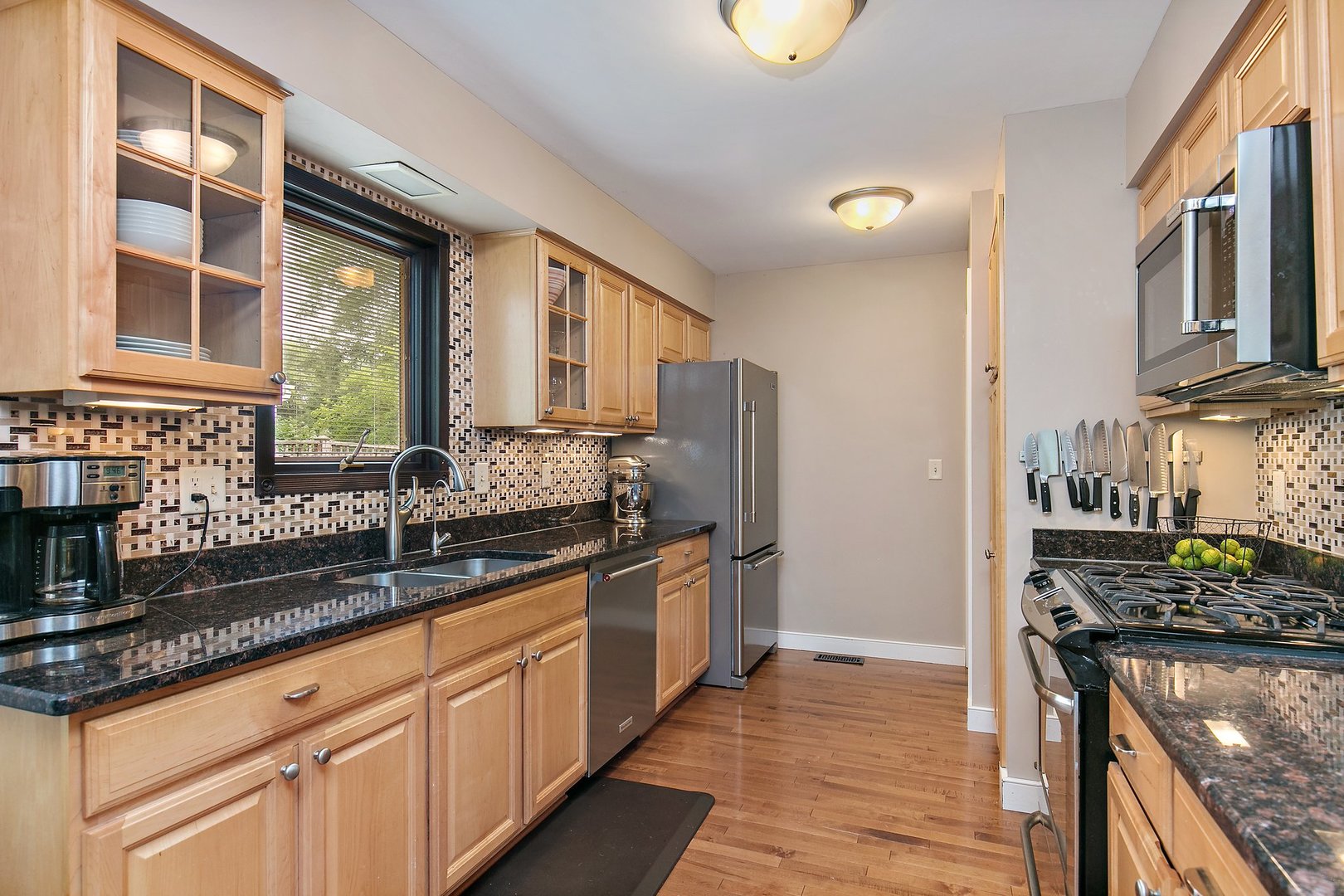 606 Old Hunt Road Fox River Grove, IL 60021 - Photo 12 of 35 a kitchen with stainless steel appliances granite countertop a stove a sink and a refrigerator