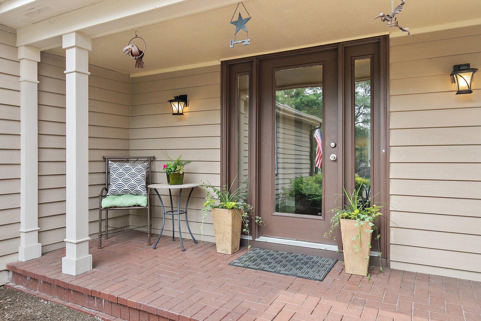606 Old Hunt Road Fox River Grove, IL 60021 - Photo 2 of 35 a view of balcony with two chairs and a potted plant