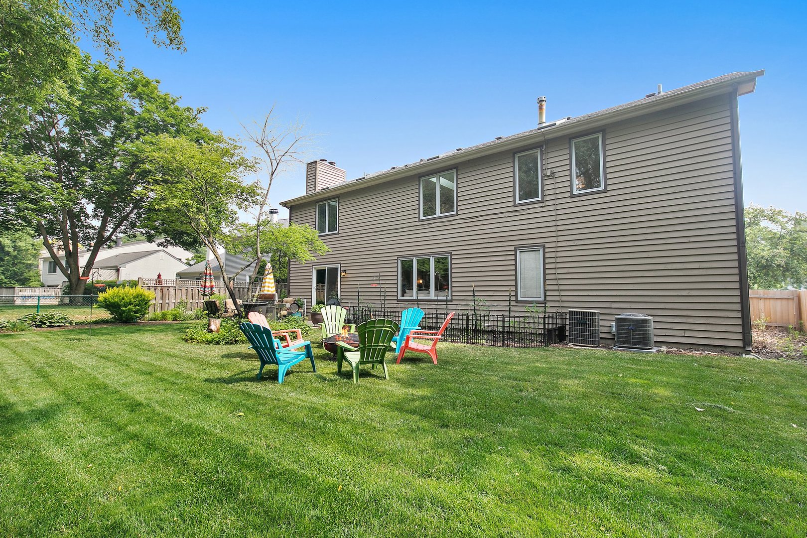 606 Old Hunt Road Fox River Grove, IL 60021 - Photo 34 of 35 a backyard of a house with table and chairs