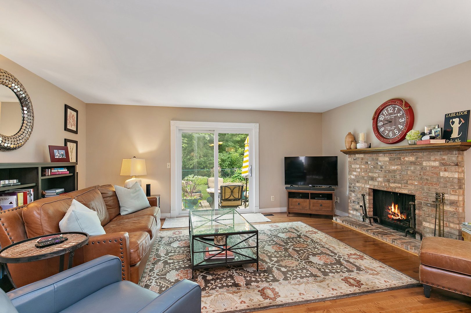 606 Old Hunt Road Fox River Grove, IL 60021 - Photo 8 of 35 a living room with furniture a flat screen tv and a fireplace