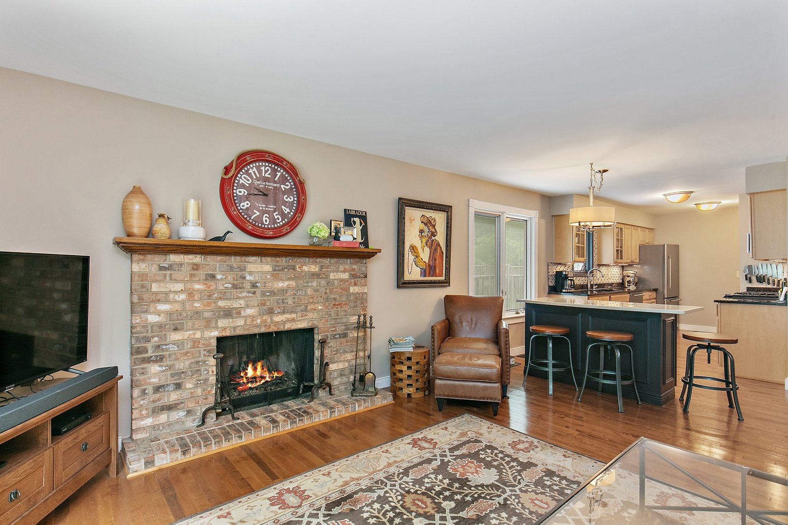 606 Old Hunt Road Fox River Grove, IL 60021 - Photo 10 of 35 a living room with furniture a flat screen tv and a fireplace