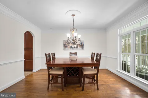 a kitchen with a stove a refrigerator and a sink