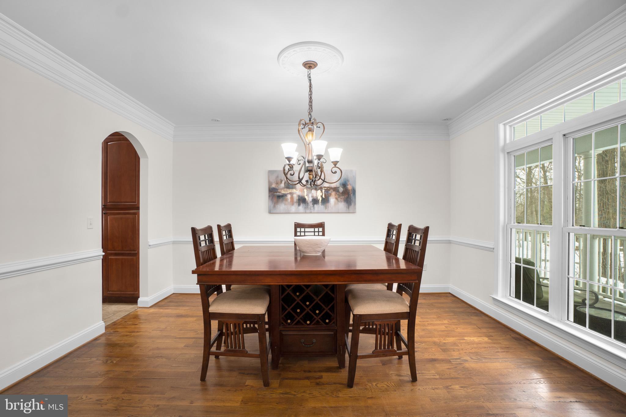 21877 Boonsboro Mountain Road Boonsboro, MD 21713 - Photo 11 of 63 a dining room with furniture a chandelier and wooden floor