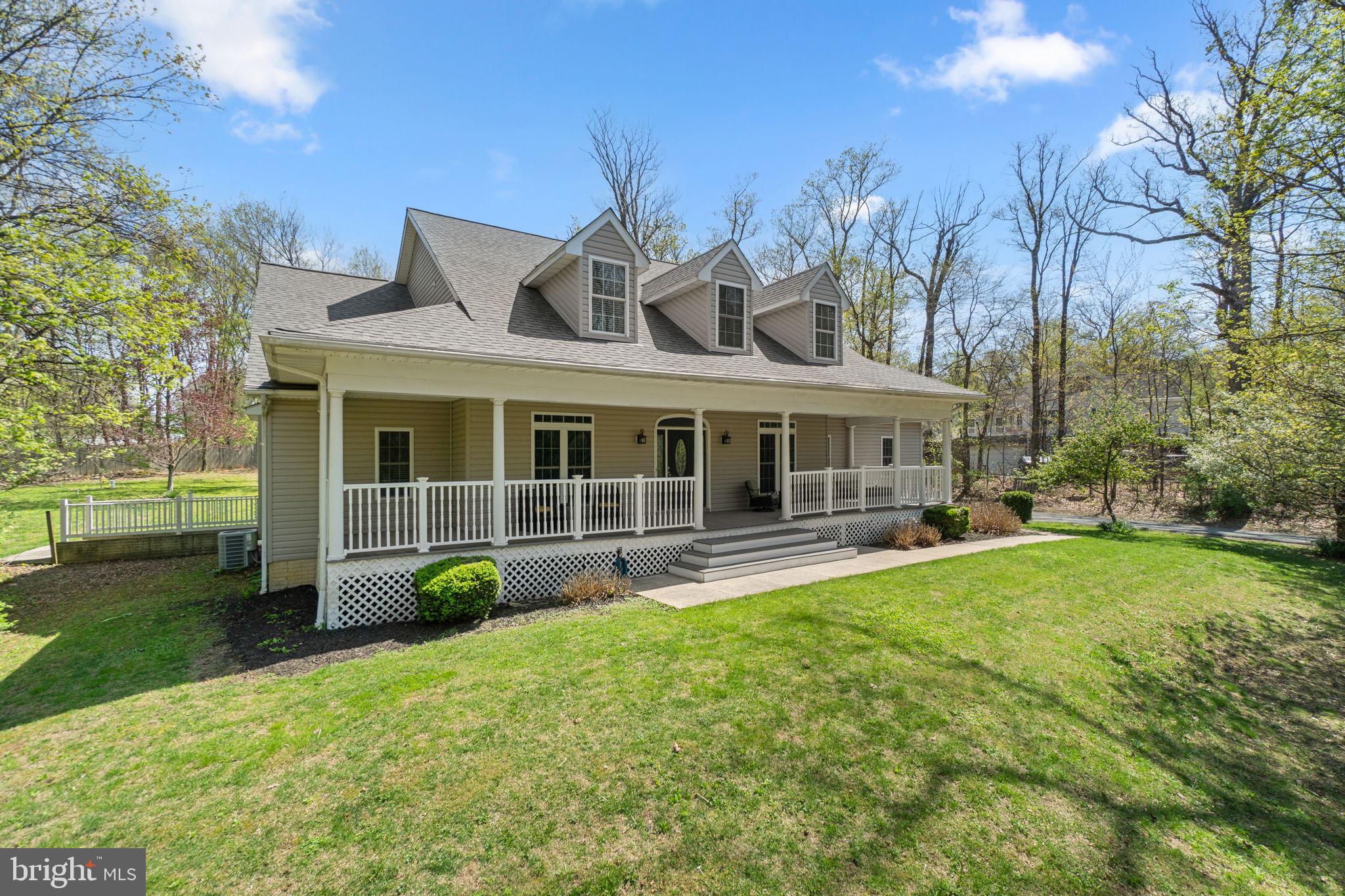 21877 Boonsboro Mountain Road Boonsboro, MD 21713 - Photo 2 of 63 a front view of a house with garden and porch