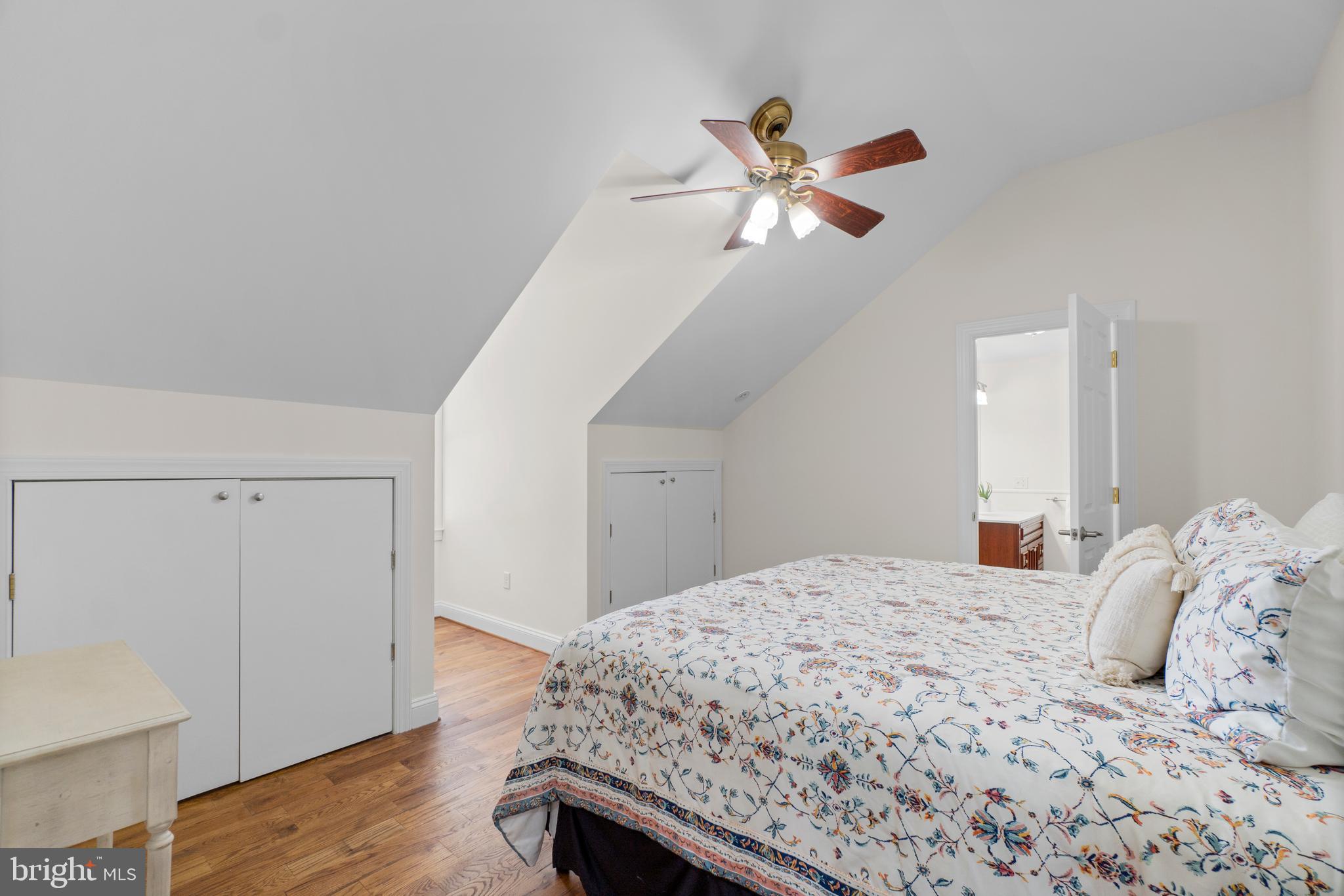 21877 Boonsboro Mountain Road Boonsboro, MD 21713 - Photo 33 of 63 a bedroom with a bed and a chandelier