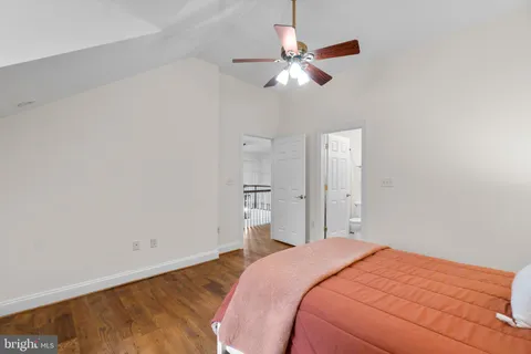 a large kitchen with stainless steel appliances granite countertop a stove a sink and a microwave