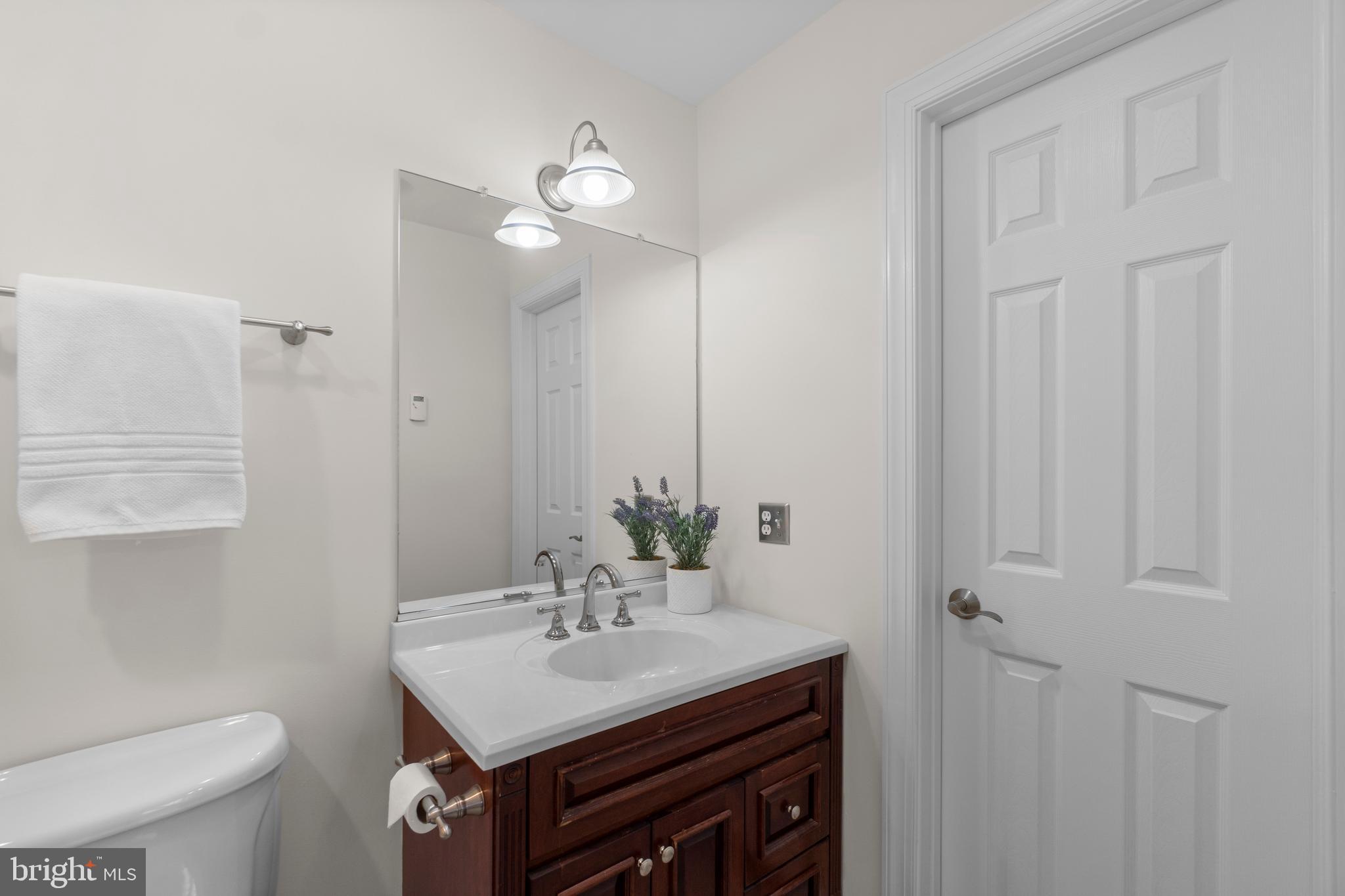 21877 Boonsboro Mountain Road Boonsboro, MD 21713 - Photo 41 of 63 a bathroom with a sink toilet and a mirror