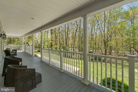 a view of entryway with wooden floor and stairs