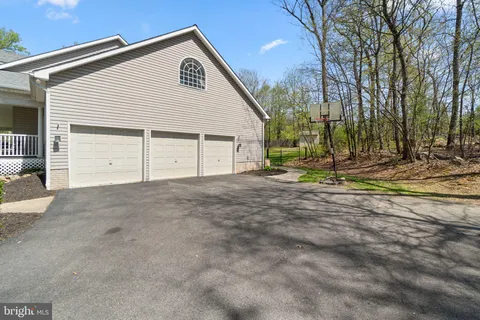 a view of a dining room with furniture and window